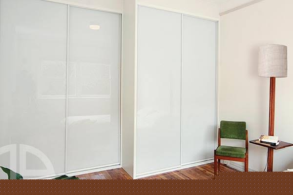 White framed wardrobe doors with pale glass panels