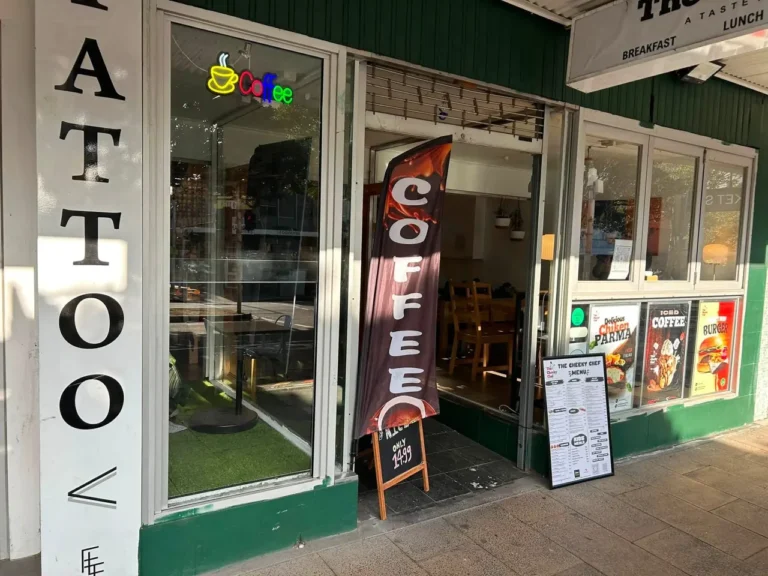 Shop entrance with clear glazed panels